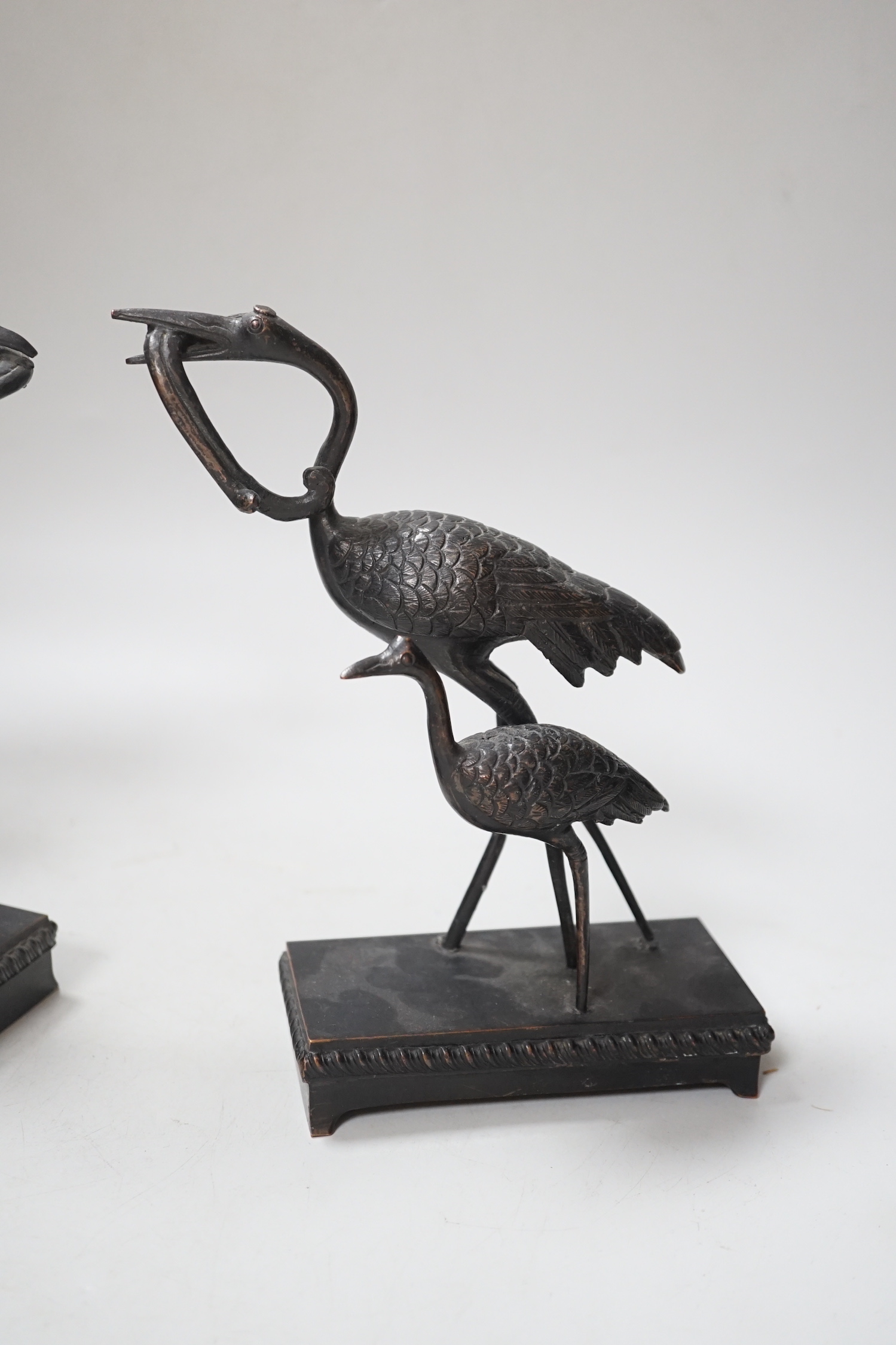 A pair of Japanese bronze crane figure groups, on later bases, 18cm high